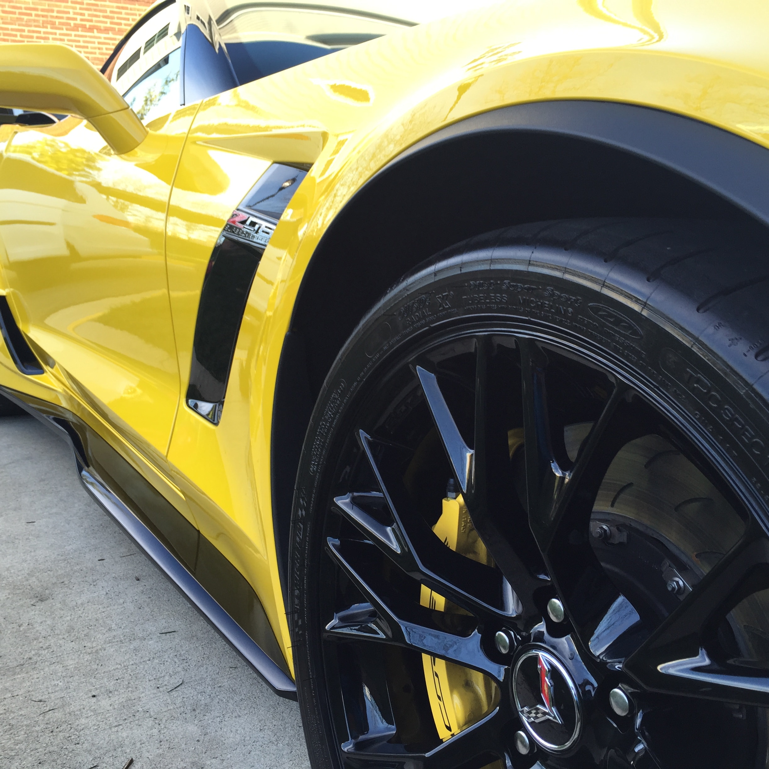 Exterior car detail Mount Pleasant SC — Yellow Corvette Z06 mirror-finish paint correction by Ocean Gloss Auto Detailing